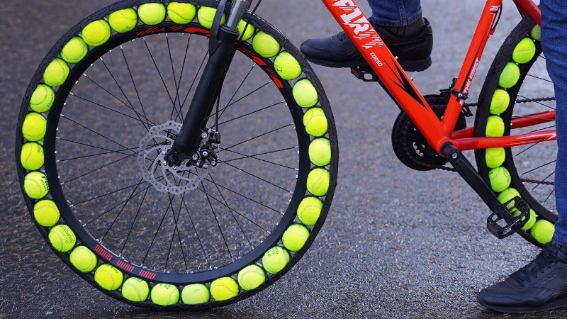 image 0 60 Tennis Balls  = 2 Bicycle Tyres
